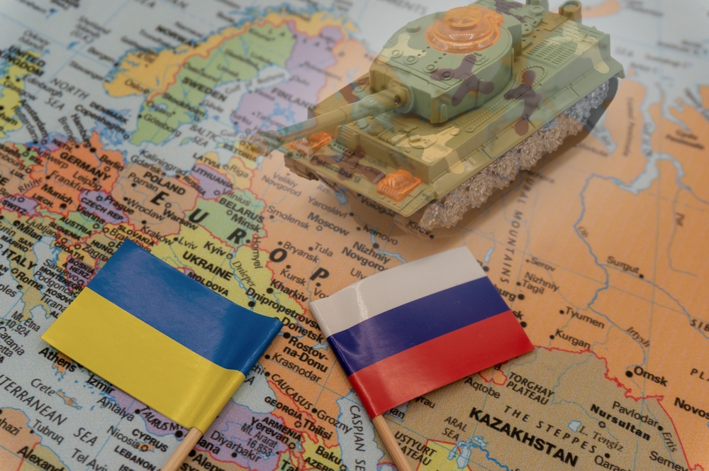 Ukraine and Russian flags on a map of Europe