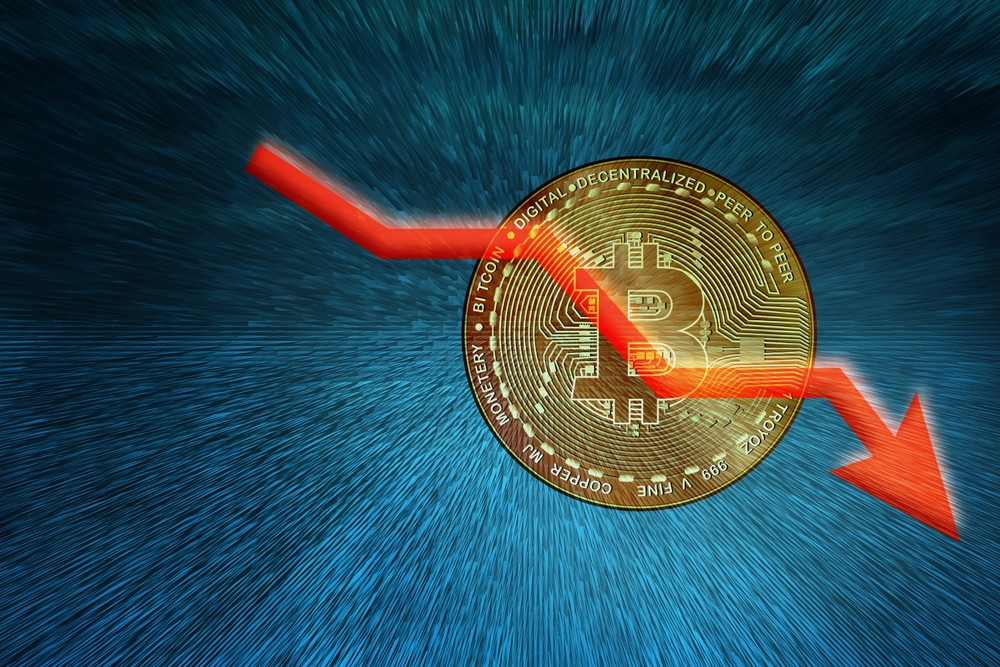 Bitcoin with downward arrow